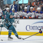 
              San Jose Sharks right wing Timo Meier, left, looks to pass while defended by Edmonton Oilers defenseman Evan Bouchard during the first period of an NHL hockey game in San Jose, Calif., Friday, Jan. 13, 2023. (AP Photo/Godofredo A. Vásquez)
            