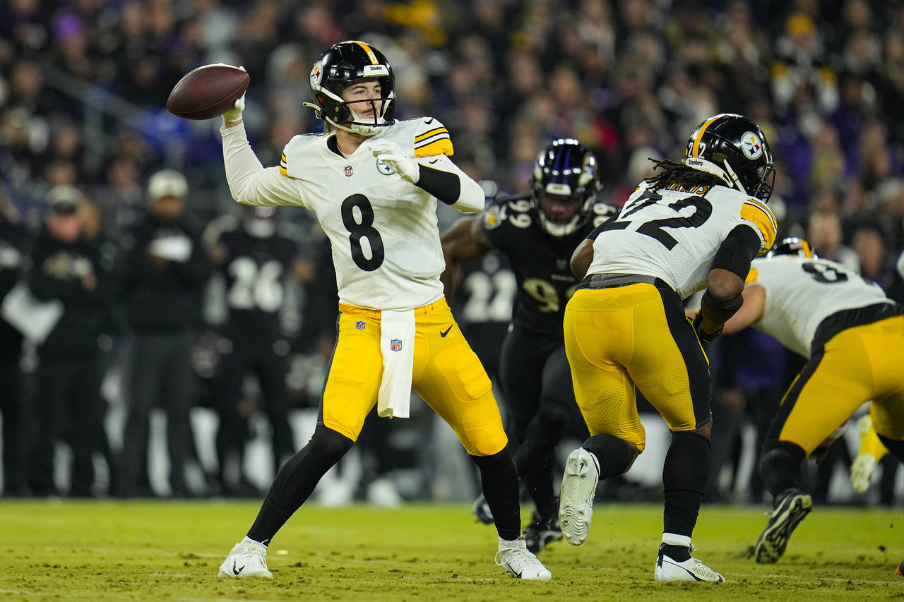 Pittsburgh Steelers quarterback Kenny Pickett (8) throws against the Baltimore Ravens in the first ...