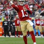 
              San Francisco 49ers quarterback Brock Purdy (13) throws a touchdown pass during the second half of an NFL football game against the Arizona Cardinals in Santa Clara, Calif., Sunday, Jan. 8, 2023. (AP Photo/Jed Jacobsohn)
            