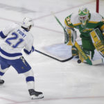 
              Minnesota Wild goaltender Filip Gustavsson (32) stops a shot by Tampa Bay Lightning center Brayden Point (21) in the first period during an NHL hockey game, Wednesday, Jan. 4, 2023, in St. Paul, Minn. (AP Photo/Andy Clayton-King)
            