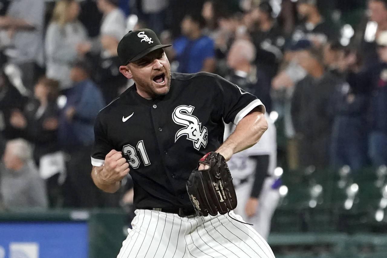 FILE - Chicago White Sox relief pitcher Liam Hendriks celebrates the team's 4-2 win over the Colora...