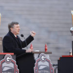 
              Georgia head coach Kirby Smart speaks while standing between the 2022 and 2023 championship trophies during a ceremony celebrating the Bulldog's second consecutive NCAA college football national championship, Saturday, Jan. 14, 2023, in Athens, Ga. (AP Photo/Alex Slitz)
            