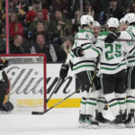 
              Dallas Stars celebrate after left wing Joel Kiviranta (25) scored against the Vegas Golden Knights during the second period of an NHL hockey game Monday, Jan. 16, 2023, in Las Vegas. (AP Photo/John Locher)
            