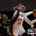 
              Southern California guard Okako Adika, right, grabs a rebound away from Stanford forward Francesca Belibi during the first half of an NCAA college basketball game Sunday, Jan. 15, 2023, in Los Angeles. (AP Photo/Mark J. Terrill)
            