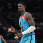 
              Phoenix Suns center Deandre Ayton (22) reacts after missing a basket during the first half of an NBA basketball game against the Minnesota Timberwolves, Friday, Jan. 13, 2023, in Minneapolis. (AP Photo/Abbie Parr)
            