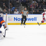 
              Washington Capitals' Sonny Milano (15) shoots as New York Islanders goaltender Ilya Sorokin (30) protects his net during the first period of an NHL hockey game Monday, Jan. 16, 2023, in Elmont, N.Y. (AP Photo/Frank Franklin II)
            