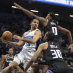 
              Sacramento Kings guard Malik Monk (0) defends against Orlando Magic guard Cole Anthony (50) who looks to pass in the first quarter in an NBA basketball game in Sacramento, Calif., Monday, Jan. 9, 2023. (AP Photo/José Luis Villegas)
            
