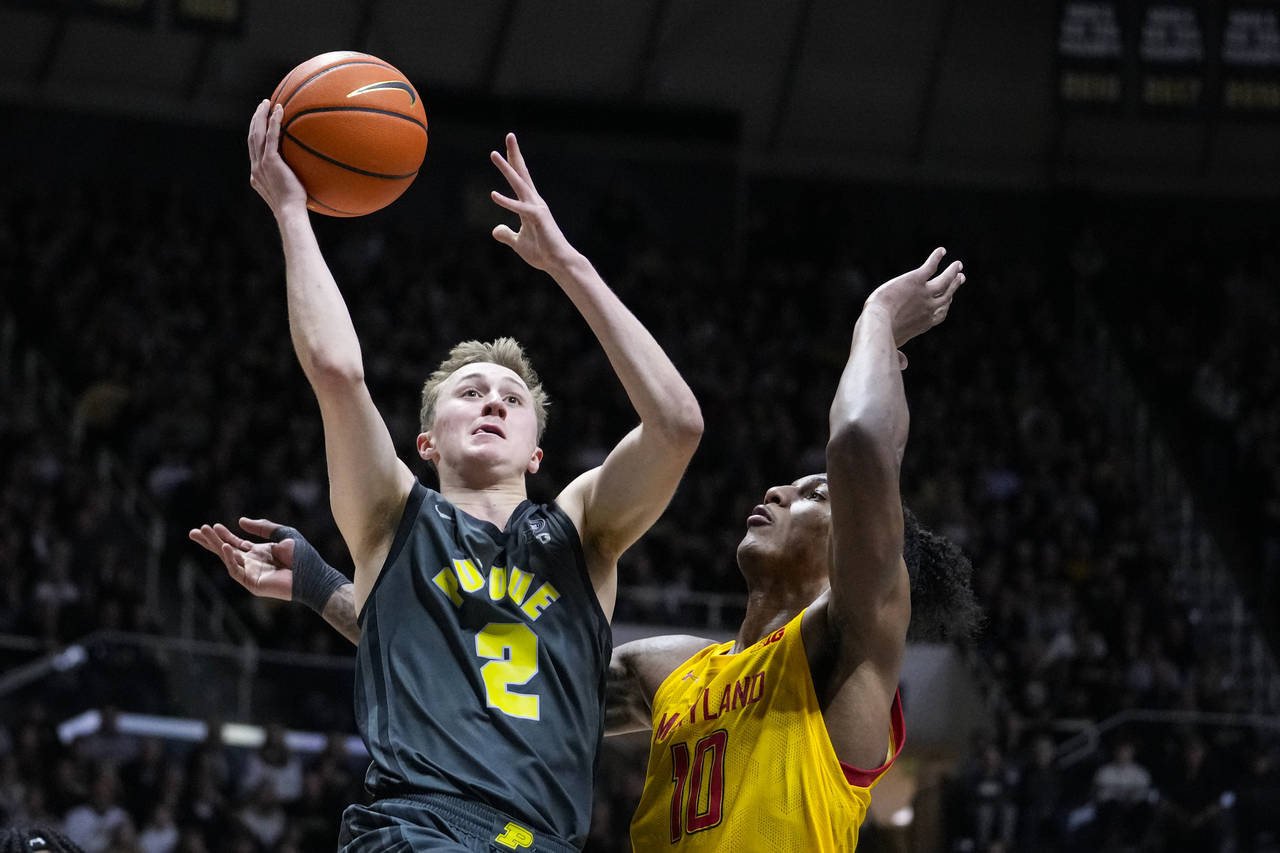 Purdue guard Fletcher Loyer (2) shoots over Maryland forward Julian Reese (10) during the second ha...