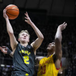 
              Purdue guard Fletcher Loyer (2) shoots over Maryland forward Julian Reese (10) during the second half of an NCAA college basketball game in West Lafayette, Ind., Sunday, Jan. 22, 2023. Purdue defeated Maryland 58-55. (AP Photo/Michael Conroy)
            