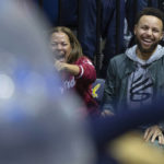 
              Sonya Curry, left, and her son, Golden State Warriors star Stephen Curry, laugh at a student competition during a timeout in the second half of an NCAA college basketball game between Stanford and California, Sunday, Jan. 8, 2023, in Berkeley, Calif. (AP Photo/D. Ross Cameron)
            