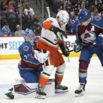
              Colorado Avalanche goaltender Pavel Francouz, left, makes a glove save as Anaheim Ducks center Adam Henrique is cleared by Avalanche defenseman Cale Makar during the second period of an NHL hockey game Thursday, Jan. 26, 2023, in Denver. (AP Photo/David Zalubowski)
            