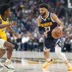 
              Denver Nuggets guard Jamal Murray, right, is defended by Indiana Pacers forward Aaron Nesmith during the second half of an NBA basketball game Friday, Jan. 20, 2023, in Denver. (AP Photo/David Zalubowski)
            