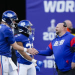 
              New York Giants quarterback Daniel Jones, left, is greeted by head coach Brian Daboll while leaving during the second half of an NFL football game against the Indianapolis Colts, Sunday, Jan. 1, 2023, in East Rutherford, N.J. (AP Photo/Seth Wenig)
            