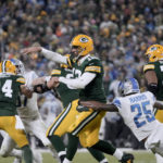 
              Green Bay Packers quarterback Aaron Rodgers (12) throws under pressure from Detroit Lions safety Will Harris (25) during the second half of an NFL football game Sunday, Jan. 8, 2023, in Green Bay, Wis. (AP Photo/Morry Gash)
            