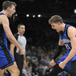 
              Orlando Magic forward Franz Wagner (22) and center Moritz Wagner (21) celebrate after Moritz Wagner scored and was fouled on the play during the second half of the team's NBA basketball game against the New Orleans Pelicans, Friday, Jan. 20, 2023, in Orlando, Fla. (AP Photo/Phelan M. Ebenhack)
            