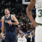 
              Dallas Mavericks guard Luka Doncic (77) hold his chest in discomfort during the first half of the team's NBA basketball game against the Boston Celtics in Dallas, Thursday, Jan. 5, 2023. (AP Photo/LM Otero)
            
