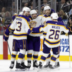 
              The Los Angeles Kings celebrate after left wing Kevin Fiala, center left, scored a goal against the Vegas Golden Knights during the first period of an NHL hockey game Saturday, Jan. 7, 2023, in Las Vegas. (AP Photo/Ellen Schmidt)
            