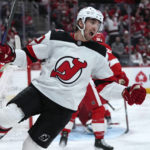 
              New Jersey Devils right wing Alexander Holtz (10) celebrates his goal against the Detroit Red Wings in the third period of an NHL hockey game Wednesday, Jan. 4, 2023, in Detroit. (AP Photo/Paul Sancya)
            