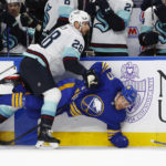 
              Buffalo Sabres center Tyson Jost (17) is checked by Seattle Kraken defenseman Carson Soucy (28) during the first period of an NHL hockey game, Tuesday, Jan. 10, 2023, in Buffalo, N.Y. (AP Photo/Jeffrey T. Barnes)
            