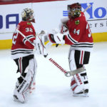 
              Chicago Blackhawks goaltender Alex Stalock (32) replaces goaltender Petr Mrazek after the Seattle Kraken scored for the fourth time against Mrazek during the first period of an NHL hockey game Saturday, Jan. 14, 2023, in Chicago. (AP Photo/Charles Rex Arbogast)
            