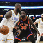 
              Los Angeles Lakers' LeBron James (6) drives past New York Knicks' Julius Randle (30) during the second half of an NBA basketball game Tuesday, Jan. 31, 2023, in New York. The Lakers won 129-123 in overtime. (AP Photo/Frank Franklin II)
            