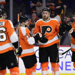 
              Philadelphia Flyers' Kevin Hayes, second from right, celebrates after his goal with Joel Farabee (86), Tony DeAngelo (77) and Noah Cates during the second period of an NHL hockey game against the Winnipeg Jets, Sunday, Jan. 22, 2023, in Philadelphia. (AP Photo/Derik Hamilton)
            