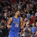 
              Dallas Mavericks' Spencer Dinwiddie reacts after making a basket during the closing seconds against the Houston Rockets in the second half of an NBA basketball game Monday, Jan. 2, 2023, in Houston. Dallas won 111-106. (AP Photo/David J. Phillip)
            