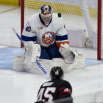 
              New York Islanders goaltender Semyon Varlamov makes a save on a shot from Ottawa Senators left wing Parker Kelly during the second period of an NHL hockey game, Wednesday, Jan. 25, 2023 in Ottawa, Ontario. (Adrian Wyld/The Canadian Press via AP)
            