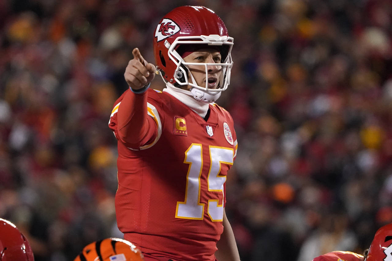 Kansas City Chiefs quarterback Patrick Mahomes signals teammates during the first half of the NFL A...
