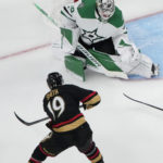 
              Vegas Golden Knights right wing Reilly Smith (19) attempts a shot on Dallas Stars goaltender Jake Oettinger (29) during the third period of an NHL hockey game Monday, Jan. 16, 2023, in Las Vegas. (AP Photo/John Locher)
            