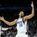 
              Dallas Mavericks guard Spencer Dinwiddie (26) celebrates a three pointer against the Phoenix Suns during the second half of an NBA basketball game, Thursday, Jan. 26, 2023, in Phoenix. (AP Photo/Matt York)
            