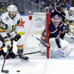 
              New York Islanders goaltender Semyon Varlamov defends against Vegas Golden Knights right wing Michael Amadio (22) in the third period of an NHL hockey game Saturday, Jan. 28, 2023, in Elmont, N.Y. The Islanders won 2-1 in overtime. (AP Photo/Adam Hunger)
            