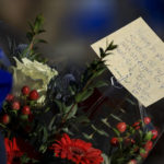
              Carol Smith carries flowers for the display set-up for Buffalo Bills' Damar Hamlin outside of University of Cincinnati Medical Center, Wednesday, Jan. 4, 2023, in Cincinnati. Hamlin was taken to the hospital after collapsing on the field during the Bill's NFL football game against the Cincinnati Bengals on Monday night. (AP Photo/Aaron Doster)
            
