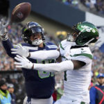 
              Seattle Seahawks tight end Noah Fant can't make the catch as New York Jets cornerback Sauce Gardner, right, defends during the second half of an NFL football game, Sunday, Jan. 1, 2023, in Seattle. (AP Photo/Ted S. Warren)
            