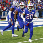
              Buffalo Bills running back Nyheim Hines (20) celebrates after running in a touchdown on a punt return during the second half of an NFL football game against the New England Patriots, Sunday, Jan. 8, 2023, in Orchard Park. (AP Photo/Jeffrey T. Barnes)
            