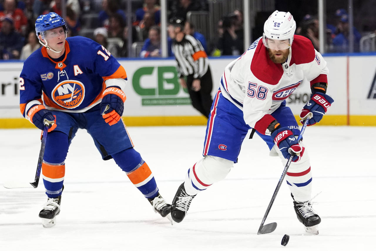 Montreal Canadiens defenseman David Savard (58) skates against New York Islanders right wing Josh B...