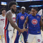 
              Detroit Pistons forward Saddiq Bey, front left, is congratulated by teammates after shooting the game-winning 3-point basket against the Golden State Warriors in an NBA basketball game in San Francisco, Wednesday, Jan. 4, 2023. (AP Photo/Jeff Chiu)
            