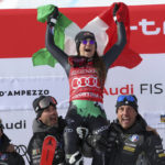 
              Italy's Sofia Goggia celebrates after winning an alpine ski, women's World Cup downhill race, in Cortina d'Ampezzo, Italy, Friday, Jan. 20, 2023. (AP Photo/Alessandro Trovati)
            