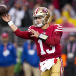 
              San Francisco 49ers quarterback Brock Purdy (13) passes against the Seattle Seahawks during the second half of an NFL wild card playoff football game in Santa Clara, Calif., Saturday, Jan. 14, 2023. (AP Photo/Godofredo A. Vásquez)
            