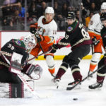 
              Arizona Coyotes goaltender Connor Ingram (39) makes a save on a shot by Anaheim Ducks center Trevor Zegras (11) as Coyotes defensemen J.J. Moser (90) and Josh Brown (3) and Ducks right wing Troy Terry (19) watch the puck during the second period of an NHL hockey game in Tempe, Ariz., Tuesday, Jan. 24, 2023. (AP Photo/Ross D. Franklin)
            