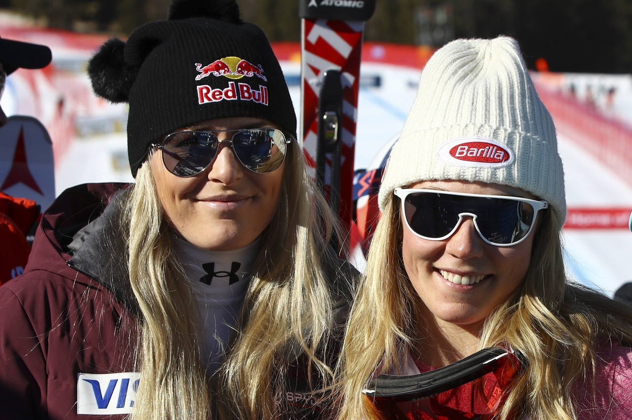 FILE - United States' Lindsey Vonn, left, and Mikaela Shiffrin pose for a photo after an alpine ski...