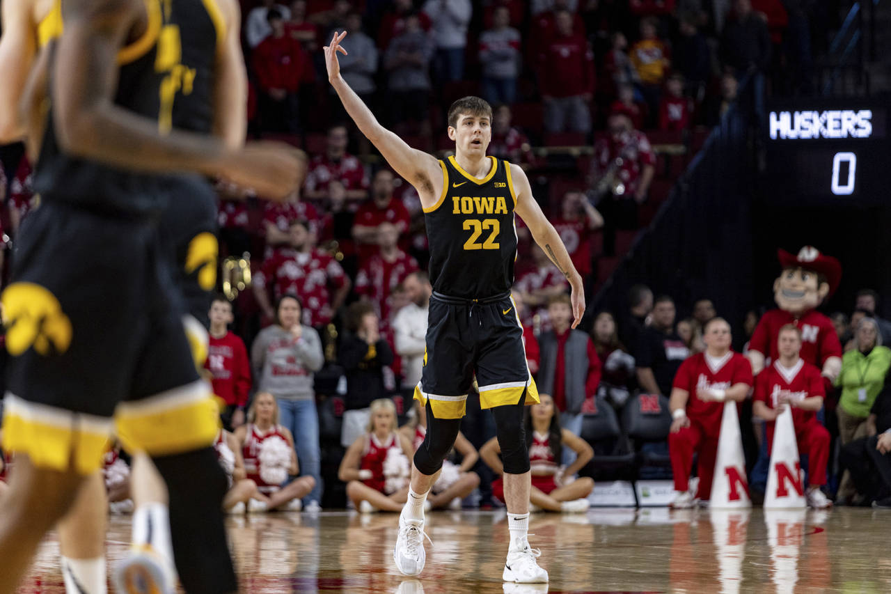 Iowa's Patrick McCaffery (22) celebrates after his 3-point basket against Nebraska in the first hal...