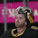 
              Vegas Golden Knights goaltender Logan Thompson (36) spits out water during the third period of an NHL hockey game against the Washington Capitals, Saturday, Jan. 21, 2023, in Las Vegas. (AP Photo/John Locher)
            