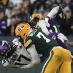 
              Minnesota Vikings wide receiver K.J. Osborn (17) is tackled by Green Bay Packers linebacker Quay Walker (7) after catching a pass during the first half of an NFL football game, Sunday, Jan. 1, 2023, in Green Bay, Wis. (AP Photo/Morry Gash)
            