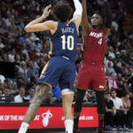 
              Miami Heat guard Victor Oladipo (4) takes a shot against New Orleans Pelicans center Jaxson Hayes (10) during the first half of an NBA basketball game, Sunday, Jan. 22, 2023, in Miami. (AP Photo/Wilfredo Lee)
            