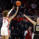 
              Ohio State guard Rikki Harris, left, shoots in front of Purdue guard Madison Layden during the first half of an NCAA college basketball game in Columbus, Ohio, Sunday, Jan. 29, 2023. (AP Photo/Paul Vernon)
            