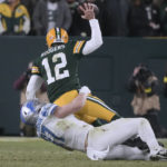 
              Detroit Lions defensive end Aidan Hutchinson (97) sacks Green Bay Packers quarterback Aaron Rodgers (12) during the first half of an NFL football game Sunday, Jan. 8, 2023, in Green Bay, Wis. (AP Photo/Morry Gash)
            