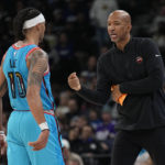 
              Phoenix Suns guard Damion Lee (10), left, and head coach Monty Williams talk during the second half of an NBA basketball game against the Minnesota Timberwolves, Friday, Jan. 13, 2023, in Minneapolis. (AP Photo/Abbie Parr)
            