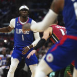
              Los Angeles Clippers guard Reggie Jackson (1) drives to the basket during the second half of an NBA basketball game against Miami Heat, Monday, Jan. 2, 2023, in Los Angeles. (AP Photo/Allison Dinner)
            