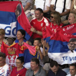 
              Supporters of Novak Djokovic of Serbia hold up banners during his semifinal against Tommy Paul of the U.S. at the Australian Open tennis championship in Melbourne, Australia, Friday, Jan. 27, 2023. (AP Photo/Ng Han Guan)
            